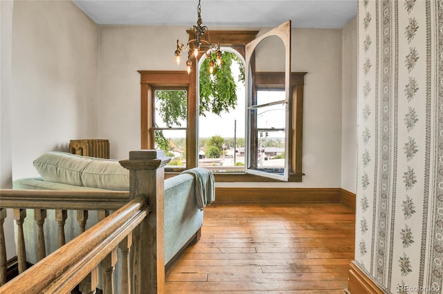 7011 Grandview Ave, Arvada, CO 80002 - sitting room with wood-type flooring and baseboards