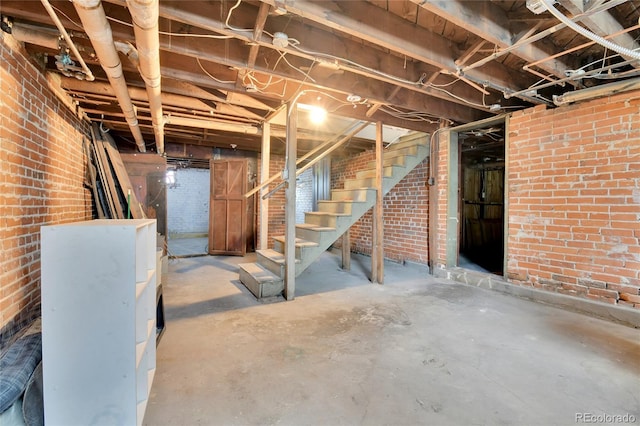 7011 Grandview Ave, Arvada, CO 80002 - unfinished below grade area with stairs and brick wall