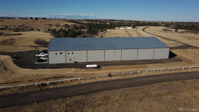 birds eye view of property with a rural view