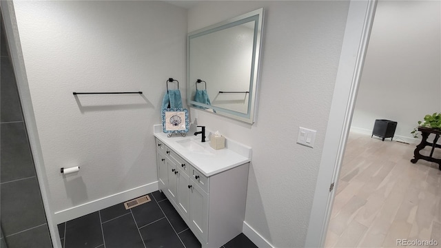 bathroom featuring vanity and tile patterned flooring