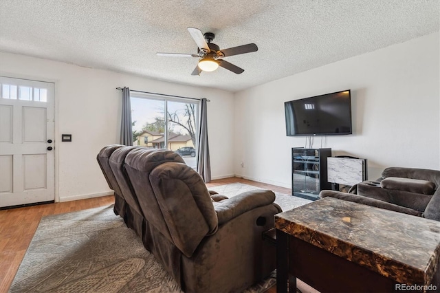 16533 E Baker Pl, Aurora, CO 80013 - living area featuring ceiling fan, a textured ceiling, and wood finished floors