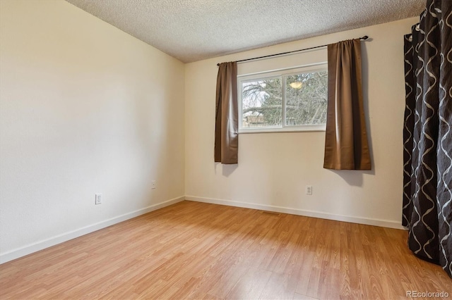 16533 E Baker Pl, Aurora, CO 80013 - empty room with wood finished floors and a textured ceiling