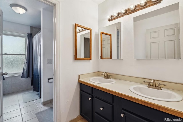 16533 E Baker Pl, Aurora, CO 80013 - bathroom with double vanity, tile patterned flooring, and a shower with shower curtain