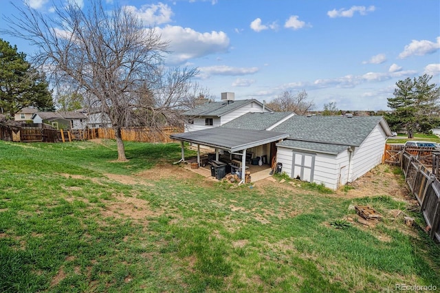 16533 E Baker Pl, Aurora, CO 80013 - rear view of property featuring a fenced backyard and roof with shingles