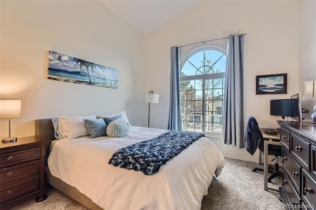 carpeted bedroom featuring vaulted ceiling