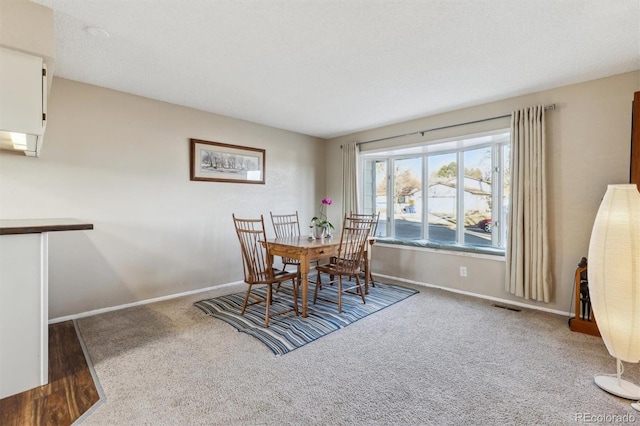 dining space with carpet