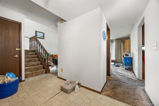 2742 S Xanadu Way, Aurora, CO 80014 - entryway with stairway and baseboards