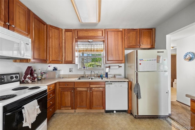 2742 S Xanadu Way, Aurora, CO 80014 - kitchen featuring white appliances, a sink, light flooring, and light countertops