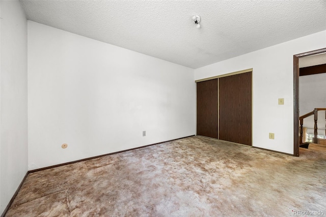2742 S Xanadu Way, Aurora, CO 80014 - unfurnished bedroom with a closet, carpet, and baseboards