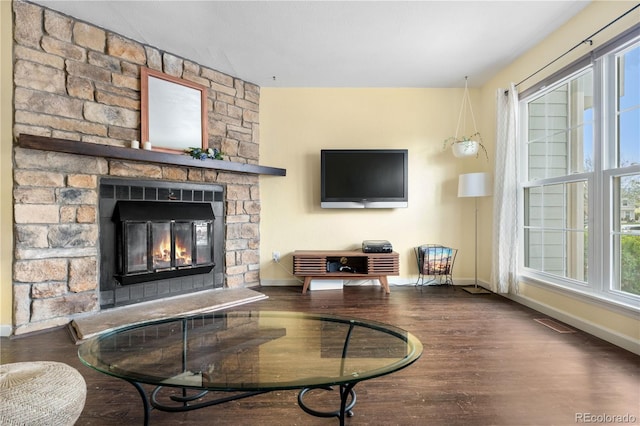 6776 S Independence St, Littleton, CO 80128 - living area with baseboards, a fireplace, and wood finished floors