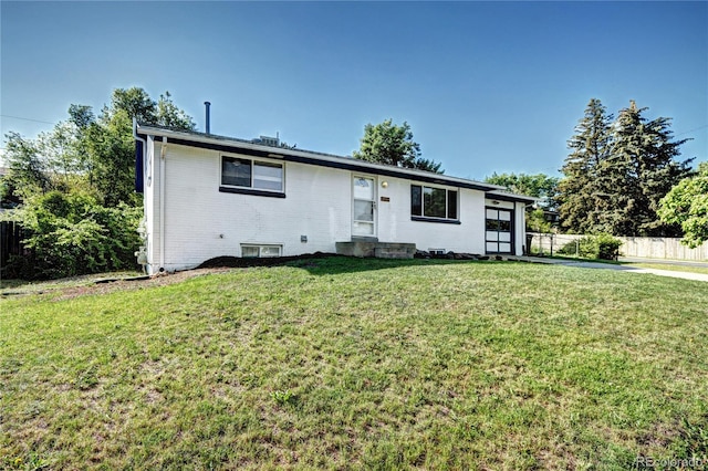 7704 Newland St, Arvada, CO 80003 - ranch-style home featuring brick siding