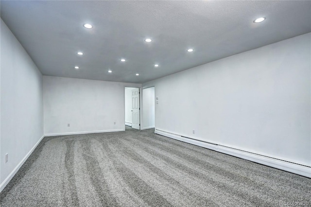 7704 Newland St, Arvada, CO 80003 - unfurnished room featuring a baseboard radiator, recessed lighting, carpet, and a baseboard heating unit