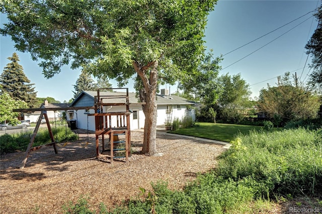 7704 Newland St, Arvada, CO 80003 - view of play area with a lawn