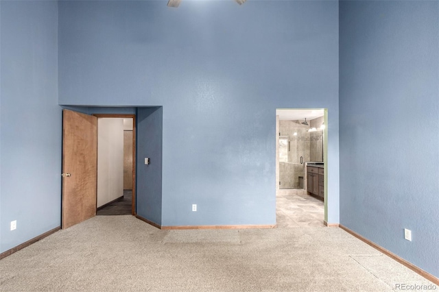 5421 S Vivian St, Littleton, CO 80127 - carpeted spare room featuring baseboards and a high ceiling