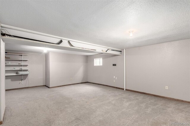 5421 S Vivian St, Littleton, CO 80127 - basement featuring carpet flooring, a textured ceiling, and baseboards