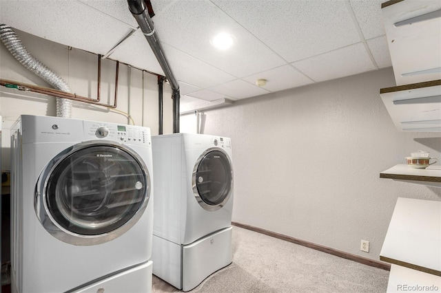 5421 S Vivian St, Littleton, CO 80127 - washroom with washer and clothes dryer, light colored carpet, baseboards, and a textured wall