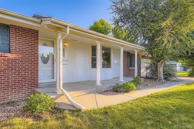 5857 S Logan Ct, Centennial, CO 80121 - property entrance featuring covered porch and brick siding