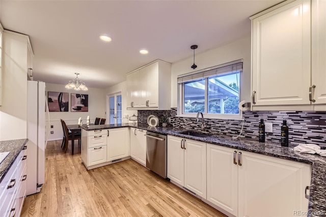 5857 S Logan Ct, Centennial, CO 80121 - kitchen with dishwasher, white cabinets, a chandelier, tasteful backsplash, and light wood finished floors