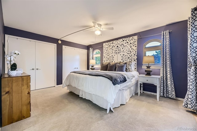 5857 S Logan Ct, Centennial, CO 80121 - bedroom with carpet flooring, multiple windows, two closets, and a ceiling fan