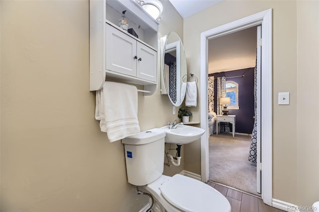 5857 S Logan Ct, Centennial, CO 80121 - bathroom featuring toilet and baseboards