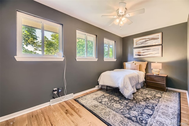 5857 S Logan Ct, Centennial, CO 80121 - bedroom featuring wood finished floors and ceiling fan