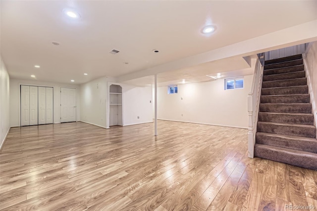 5857 S Logan Ct, Centennial, CO 80121 - finished below grade area with light wood-style flooring, stairs, and recessed lighting