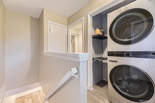 5857 S Logan Ct, Centennial, CO 80121 - laundry room featuring stacked washer and clothes dryer and light wood finished floors