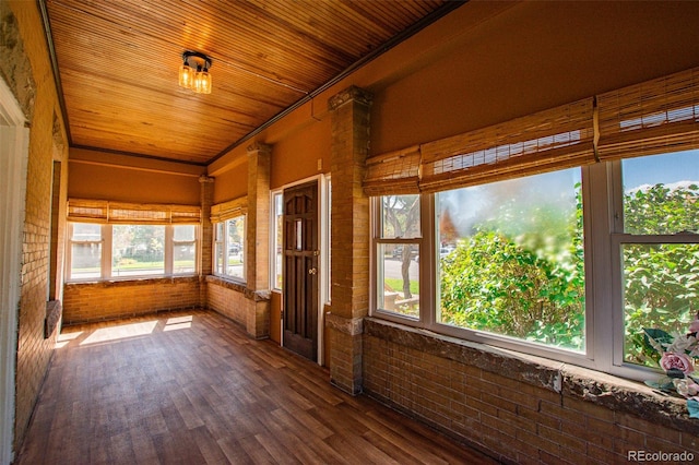 unfurnished sunroom with wooden ceiling