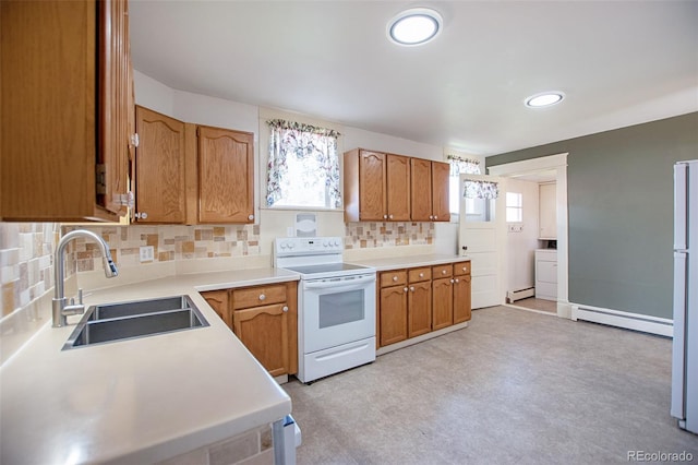 kitchen featuring decorative backsplash, white appliances, sink, and baseboard heating