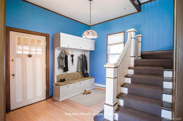 mudroom with crown molding, a baseboard radiator, and light hardwood / wood-style floors