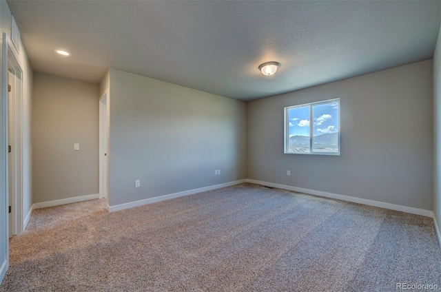 16858 Greyhawk Dr, Monument, CO 80132 - unfurnished room with baseboards and light colored carpet