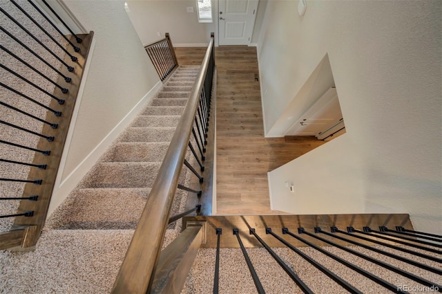 16858 Greyhawk Dr, Monument, CO 80132 - staircase featuring baseboards and wood finished floors