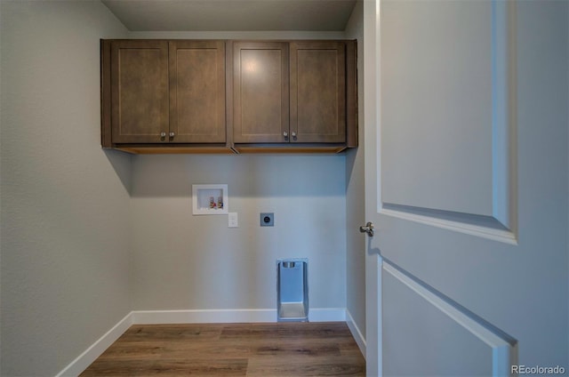 16858 Greyhawk Dr, Monument, CO 80132 - washroom featuring wood finished floors, baseboards, hookup for a washing machine, cabinet space, and hookup for an electric dryer