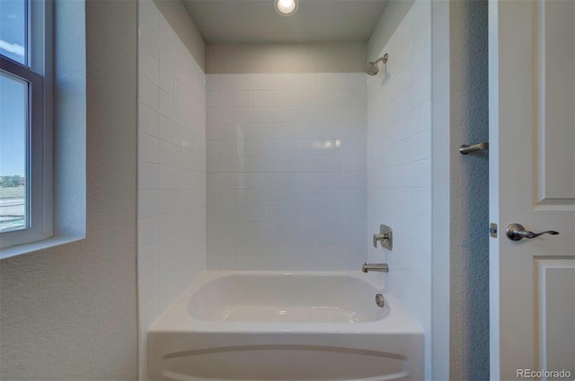 16858 Greyhawk Dr, Monument, CO 80132 - full bathroom with a textured wall and shower / tub combination