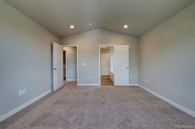 16858 Greyhawk Dr, Monument, CO 80132 - unfurnished bedroom with baseboards, carpet, and lofted ceiling