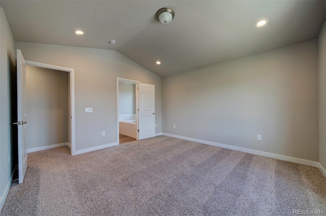 16858 Greyhawk Dr, Monument, CO 80132 - unfurnished bedroom with recessed lighting, baseboards, vaulted ceiling, and carpet