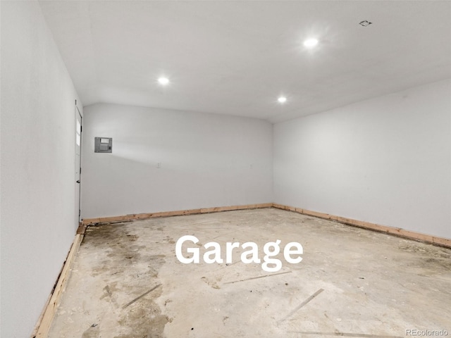 unfurnished room with recessed lighting, baseboards, and electric panel