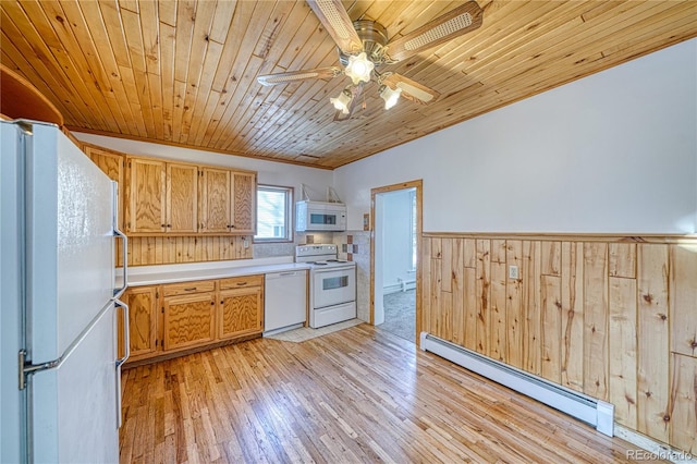 kitchen with wood walls, white appliances, a baseboard heating unit, light wood-type flooring, and wood ceiling