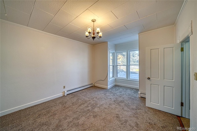 spare room featuring carpet, a chandelier, ornamental molding, and a baseboard heating unit