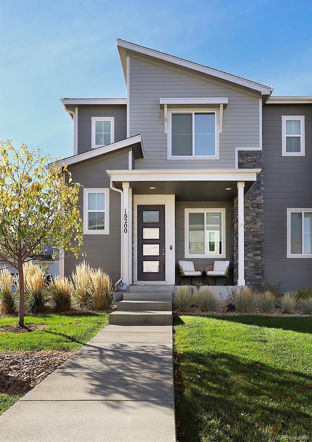 modern home featuring a front yard