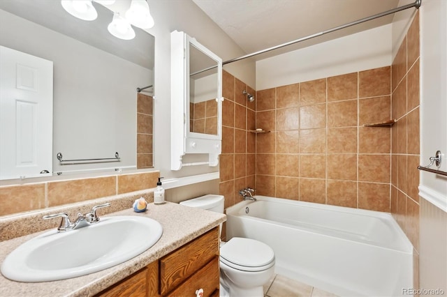 bathroom featuring toilet, vanity, and shower / bath combination