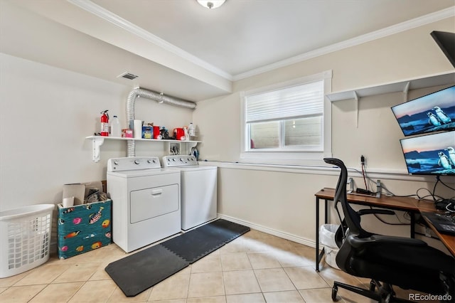 washroom with washer and clothes dryer, crown molding, laundry area, and light tile patterned floors