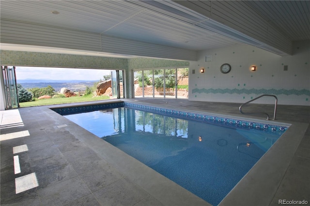 view of swimming pool with a mountain view