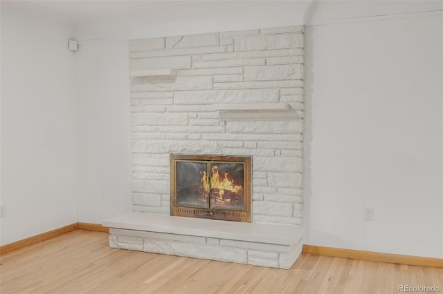 6994 Teller Ct, Arvada, CO 80003 - detailed view of wood finished floors and a fireplace