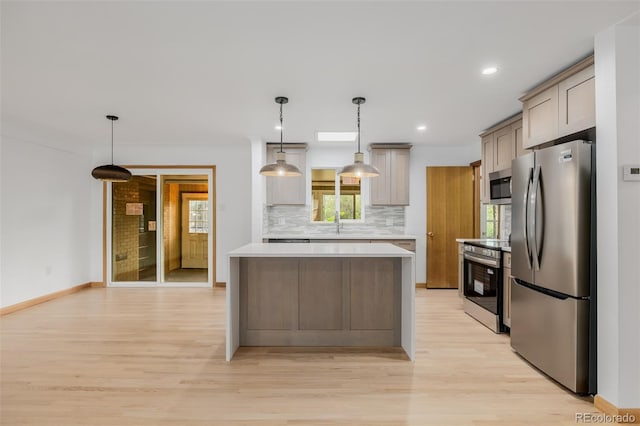6994 Teller Ct, Arvada, CO 80003 - kitchen with appliances with stainless steel finishes, light wood-style floors, backsplash, light countertops, and recessed lighting