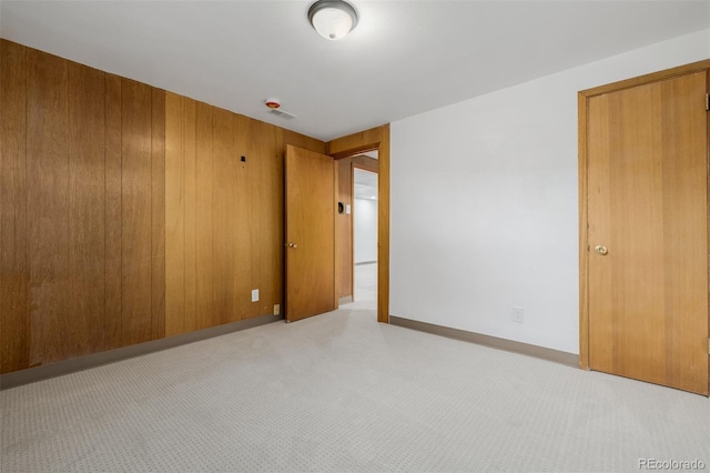 6994 Teller Ct, Arvada, CO 80003 - spare room featuring carpet floors and wood walls