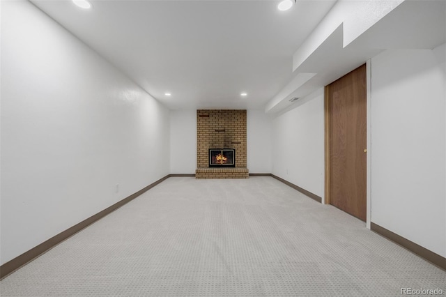 6994 Teller Ct, Arvada, CO 80003 - unfurnished living room with recessed lighting, a brick fireplace, and light colored carpet