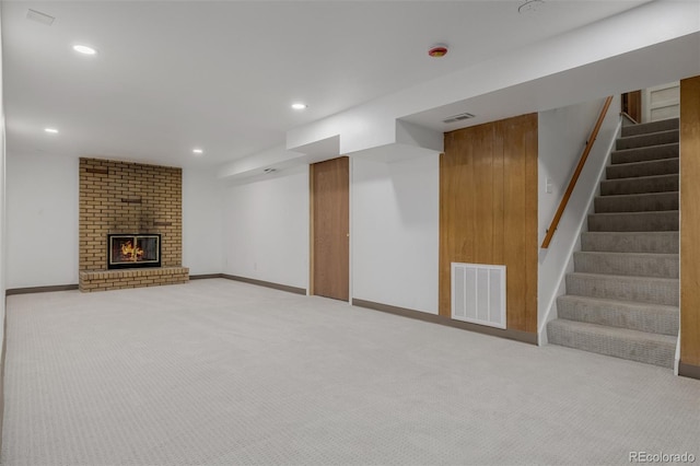 6994 Teller Ct, Arvada, CO 80003 - finished basement with stairway, carpet flooring, recessed lighting, and a brick fireplace