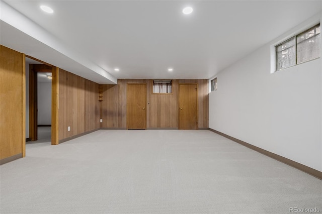 6994 Teller Ct, Arvada, CO 80003 - below grade area with recessed lighting, light carpet, and wood walls