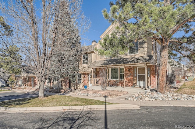 view of front of house with brick siding